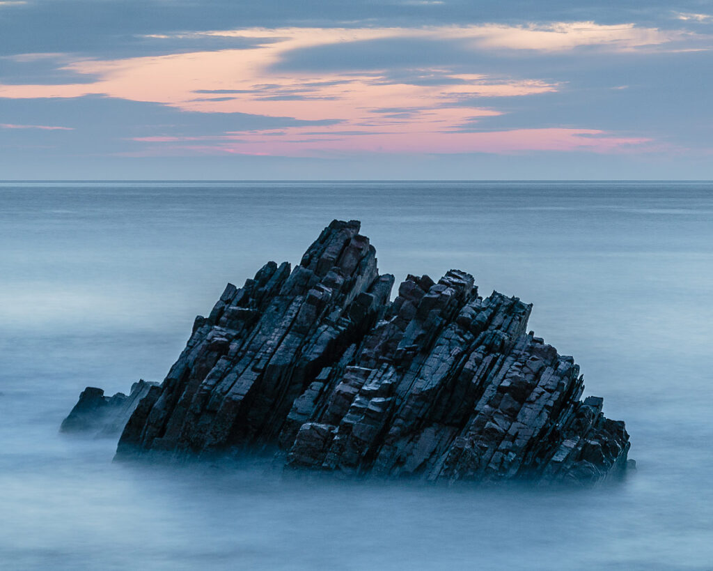 Cullen bay sea stack at sunrise, moray coast, scotland